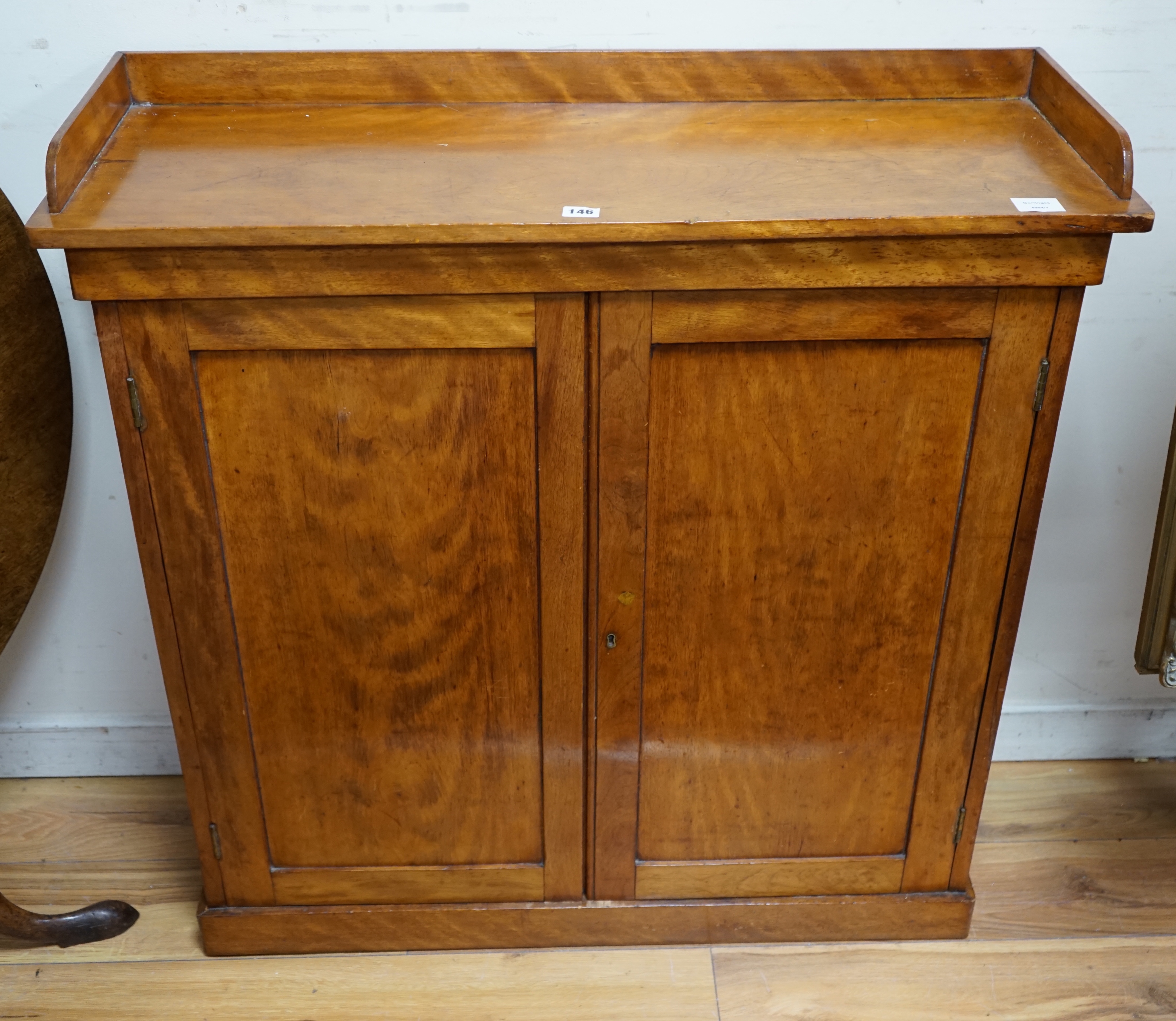 A Victorian mahogany side cabinet, fitted with twin panelled doors, width 96cm depth 33cm height 98cm